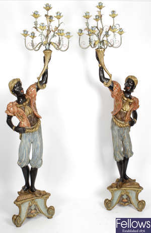 A pair of mid 20th century carved wooden and gesso Blackamoor floor standing lamps.