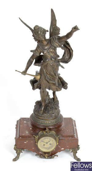 A late 19th century spelter and rouge marble mantel clock.