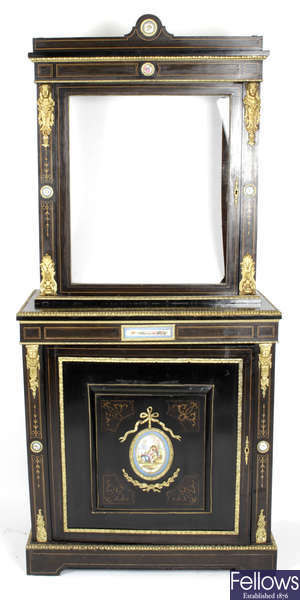 A late 19th century ebonised display cabinet.