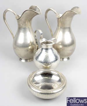 A pair of 20th century 925 sterling silver water jugs.