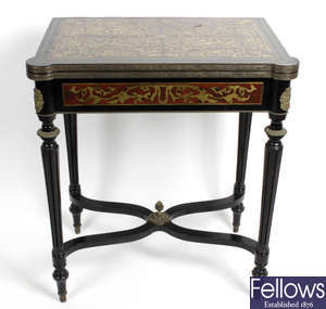 A late 19th century simulated tortoiseshell and boulle work fold over topped card table.