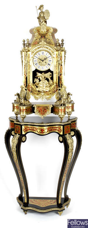 A large and impressive reproduction simulated tortoiseshell and boulle work clock, together with a small console table.