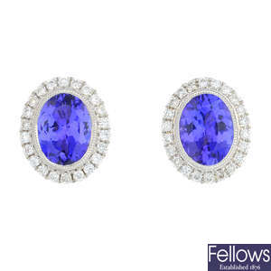 A pair of 18ct gold tanzanite and diamond cluster earrings.