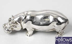 A modern silver figure of a hippopotamus.
