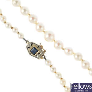 A cultured pearl single-strand necklace, with sapphire clasp.