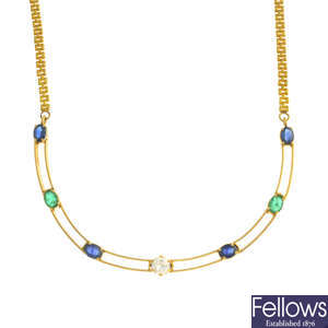 A diamond, sapphire and emerald necklace.