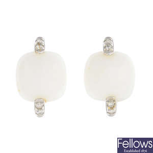 A pair of white gem and diamond earrings.
