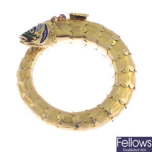 A 1980s gold enamel and gem-set fish bangle.