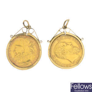 Two coin pendants.