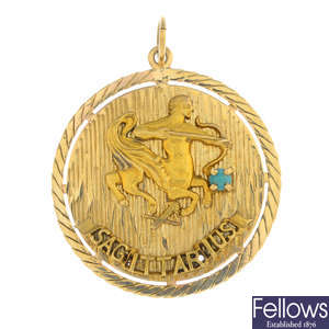 A 1970s 9ct gold zodiac pendant.