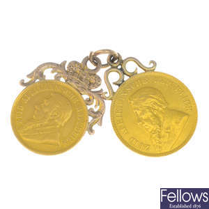 Two coin pendants.