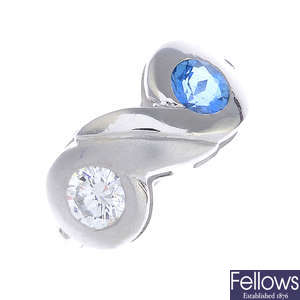 A platinum diamond and aquamarine two-stone ring.