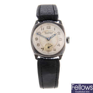 BUREN - a mid-size silver Grand Prix wrist watch with two silver wrist watches.