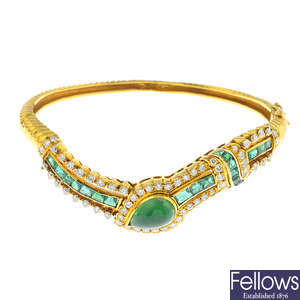 An emerald and diamond hinged bangle.