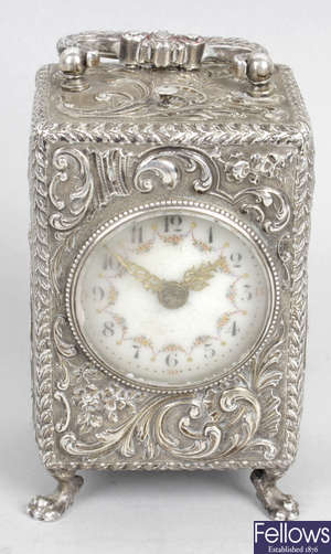 A 19th century Continental silver cased alarm repeater carriage clock.