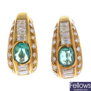 A pair of synthetic emerald and diamond earrings.