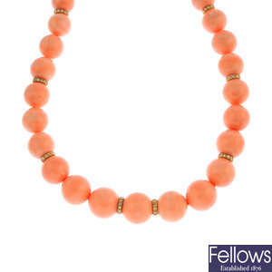 A coral and diamond necklace.