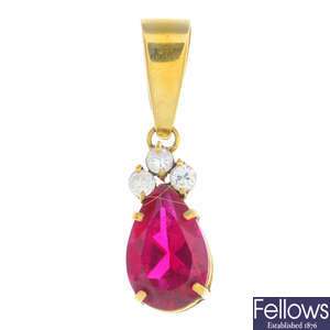 A synthetic ruby and cubic zirconia pendant.