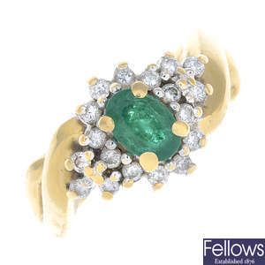 An emerald and diamond ring.