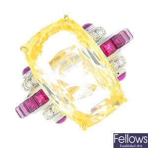 A yellow sapphire, ruby and diamond ring.
