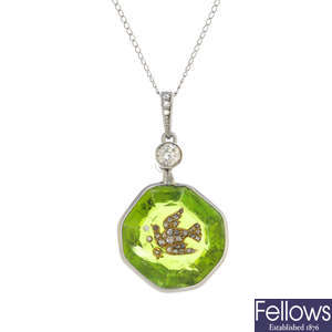 A peridot and diamond pendant, with chain.