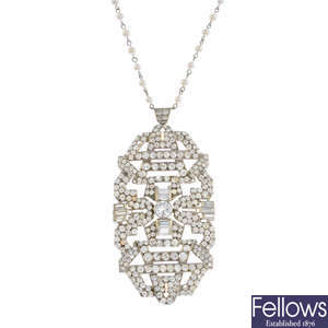 A diamond pendant, on cultured pearl chain.