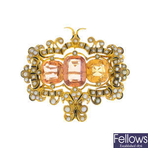 A late 19th century gold topaz, split pearl and enamel brooch.