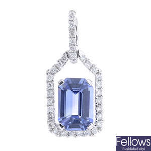 A sapphire and diamond pendant.