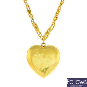 DAVID THOMAS - a 1970s 18ct gold heart pendant and chain.
