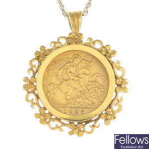 A full sovereign pendant, with chain.