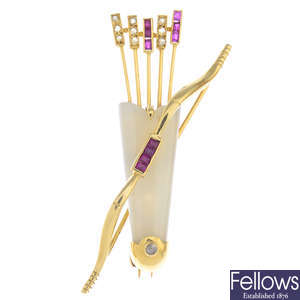 CARTIER - an 18ct gold chalcedony, ruby and diamond bow and arrow, quiver brooch.
