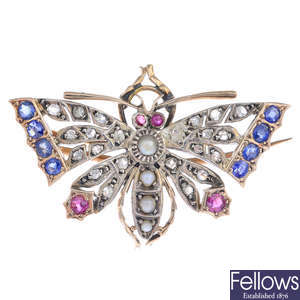 A late Victorian gold and silver diamond, sapphire, ruby and split pearl butterfly brooch.