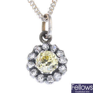 An early 20th century 'yellow' diamond and diamond cluster pendant, with later 18ct gold chain.