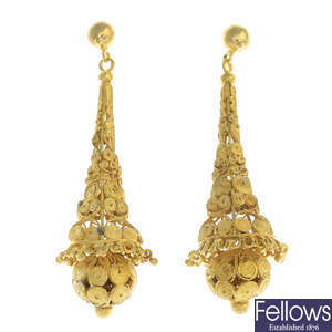A pair of filigree earrings.