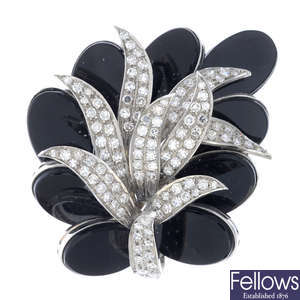 A mid 20th century 18ct gold diamond and onyx foliate brooch.