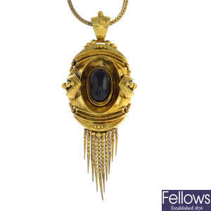 A mid Victorian gold garnet locket pendant.