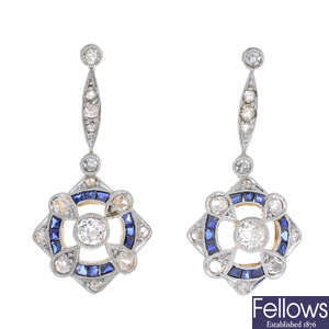 A pair of gold sapphire and diamond earrings.