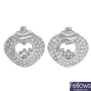 A pair of diamond earrings.