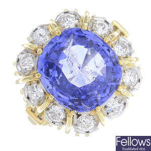 A gold Sri Lankan sapphire and diamond cluster ring.