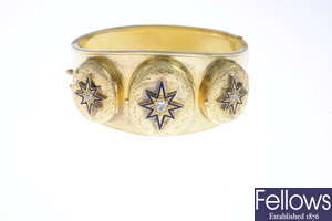 A late Victorian gold triple locket hinged bangle.