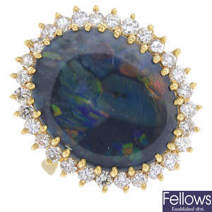An 18ct gold black opal and diamond cluster ring.