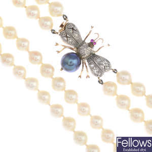 A cultured pearl two-row necklace with gem-set insect clasp.