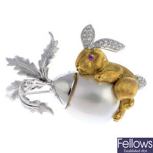 A cultured pearl, diamond and pink sapphire rabbit brooch.
