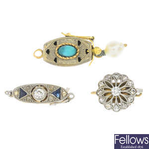 Five early 20th century diamond and gem-set clasps.