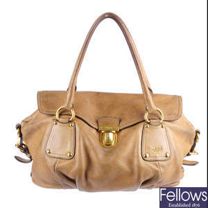 PRADA - a tan leather handbag.