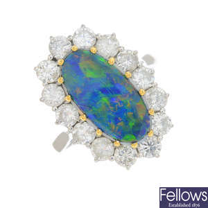 An opal doublet and diamond cluster ring.