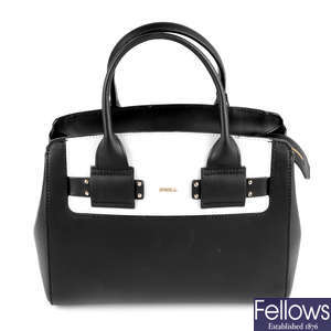 FURLA - a small black and white leather handbag. 