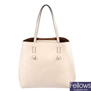 FURLA - a beige leather Vittoria handbag.