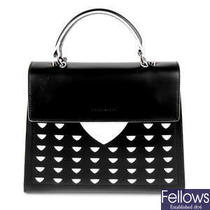 COCCINELLE - a black and white leather handbag.