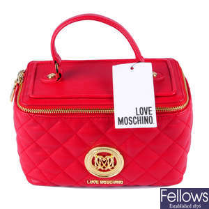 MOSCHINO - a quilted red Love Moschino vanity handbag.